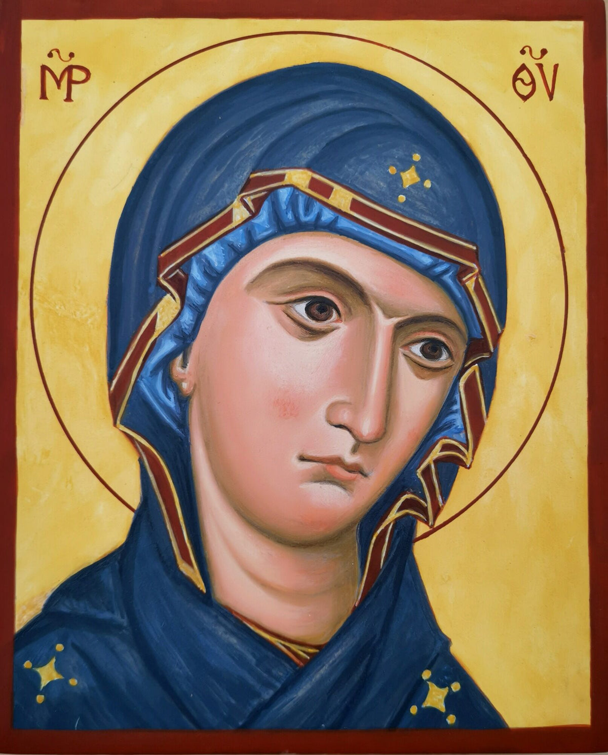 Icon of the Theotokos, Mother of God,  with blue robe and gold accents on a yellow background